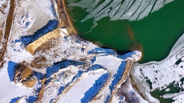 Winter aerial view featuring a frozen quarry in Dover, New Hampshire