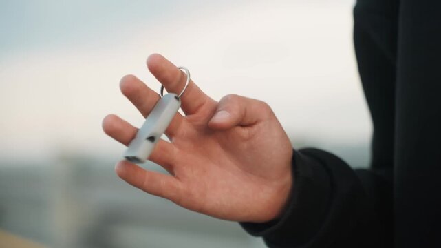 Bright hand unlocking. Hand with light complexion managing vessel access near pier during daytime. Lightcolored hand manipulating keyless entry device beside boat dock in sunlight before boarding