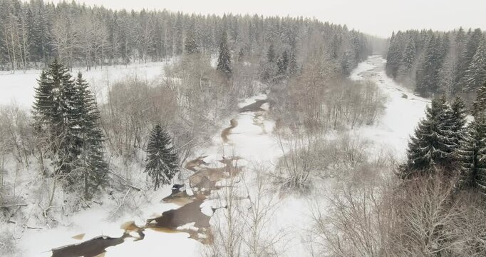 Aerial view of serene winter Vantaanjoki river scene in cloudy weather, Helsinki and Vantaa, Finland, Europe.