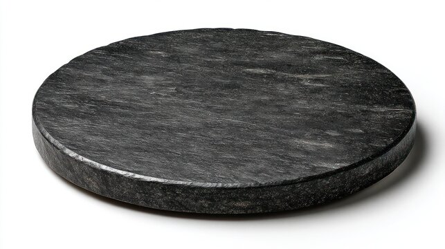 Round dark grey textured stone plate or slate serving board isolated on white. Minimalist display stand or coaster for product photography.
