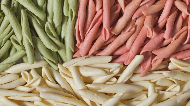 Three-colored fusilli green, white, orange healthy food