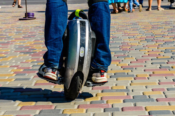 Man riding monowheel in the city park © ihorbondarenko