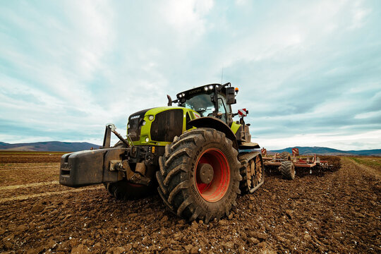 CLAAS AXION Tractor Working on Plowed Field &ndash; Modern Agricultural Machinery, Soil Preparation and Farmland Cultivation