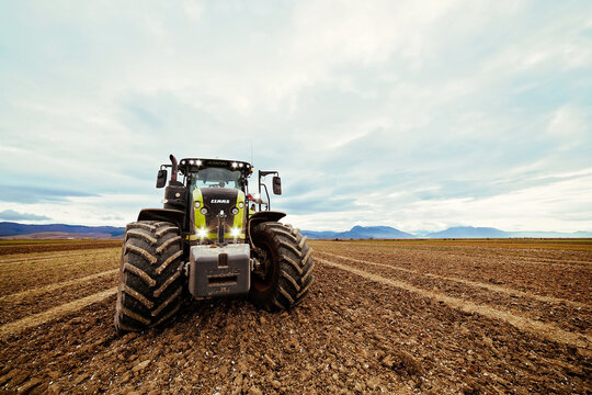 CLAAS AXION Tractor Working on Plowed Field &ndash; Modern Agricultural Machinery, Soil Preparation and Farmland Cultivation