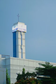 Depok, Indonesia - March 29th, 2026: Minimalist view of Bank BJB logo tower against a clear blue sky