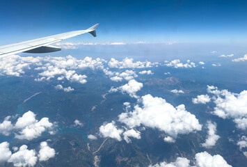 Mornos Reservoir and mountain landscape under scattered clouds in Central Greece. Aerial view from a plane window © Rawf8