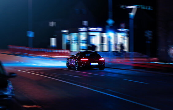 Mercedes‑AMG GTS Driving at Night &ndash; High‑Performance Sports Car in Motion with Urban Lights and Dynamic Street Scene