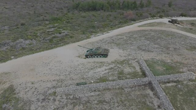 Aerial drone video of an old military tank on the hill