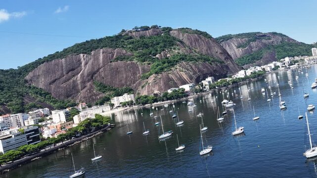 Urca Beach In Rio De Janeiro In Brazil. Sugarloaf Mountain Scenery. Downtown District. Guanabara Bay Skyline. Urca Beach In Rio De Janeiro In Brazil. Beautiful Cityscape. 