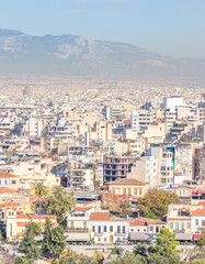 Naklejka premium Panoramic Athens City Skyline With Dense Urban Buildings And Mountain Backdrop In Greece
