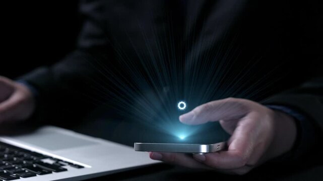 This image showcases a smartphone displaying a glowing award symbol, representing success and validation in the digital age, complemented by a laptop in the background. Qubit