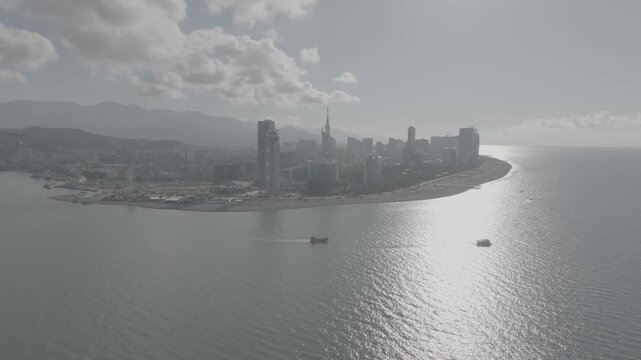 batumi, georgia, harbor, port, marina, yacht, boats, jet ski, sea, black sea, aerial, drone, cinematic, 4k, log footage, color grading, travel, tourism, summer, vacation, seascape, coastline, skyline,