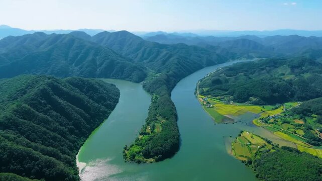 Winding River Flowing Through Green Mountains