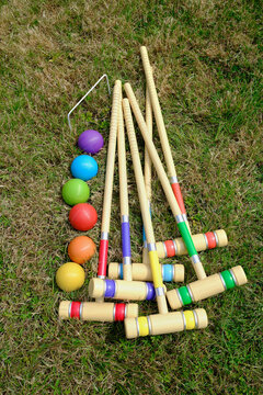 Old Fashioned Summertime Garden Party Game - Top Down Flat Lay of a Vibrant Croquet Set on a Summer Lawn