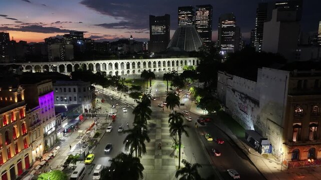 Sunset Skyline In Arches Of Lapa In Rio De Janeiro In Brazil. Sunset Landscape. Downtown District. Landmark Monument. Sunset Skyline In Arches Of Lapa In Rio De Janeiro In Brazil. 