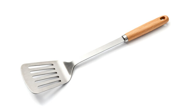 Stainless steel slotted spatula with a natural wooden handle, isolated on white background. Durable kitchen utensil for cooking and flipping.