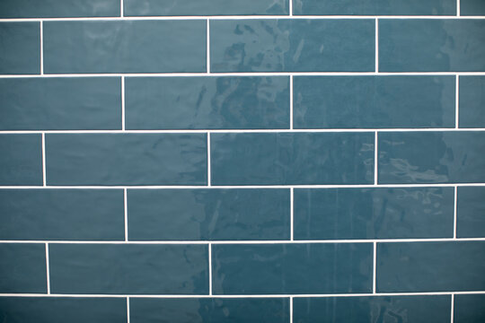 Blue Subway Shower Tile with white grout on the wall 