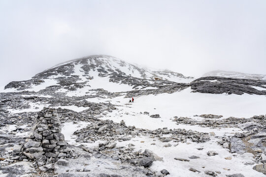 Snow covered Haba Snow Mountain landscape with dramatic clouds in Yunnan, China