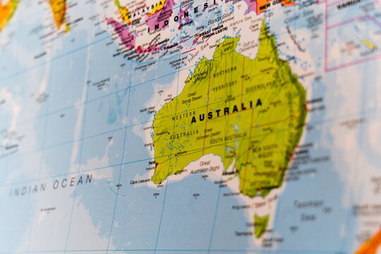 political map with shallow depth of field prominently showing Australia and its states including Western Australia, Northern Territory, Queensland, South Australia, New South Wales, Victoria