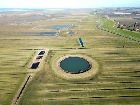 Aerial view of a traditional circular water reservoir or Dobbe water pond in Friesland, The Netherlands