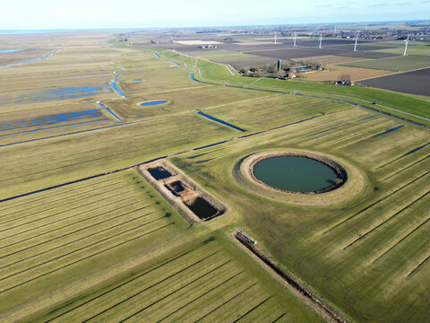 Aerial view of a traditional circular water reservoir or Dobbe water pond in Friesland, The Netherlands