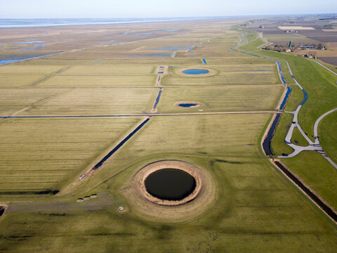 Aerial view of a traditional circular water reservoir or Dobbe water pond in Friesland, The Netherlands