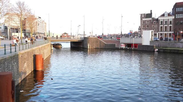 A view of the busy traffic above and below the Kamper bridge in the city centre of Amsterdam.