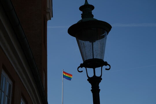 old street lamp in Copenhagen with LGTB+ pride flag