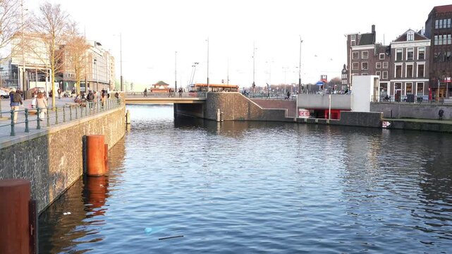 A view of the busy traffic above and below the Kamper bridge in the city centre of Amsterdam.