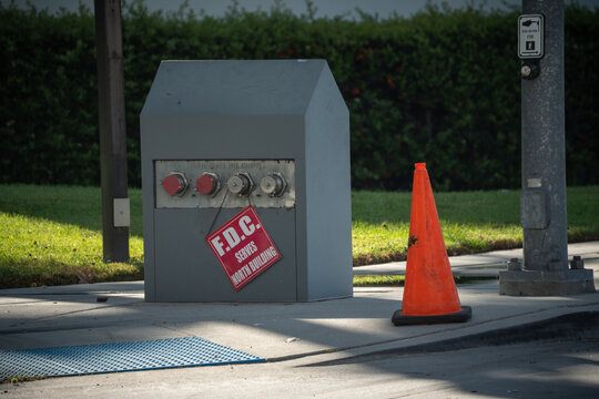 Fire Department Connection serves north building with traffic cone nearby