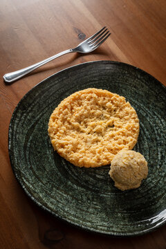 A crumbly frico made with aged cheese and polenta. A typical Friulian dish.