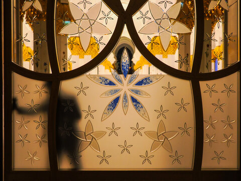 Sheikh Zayed Grand Mosque glass door silhouette Abu Dhabi copy space