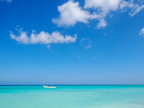 Fishing Boat Floating on Turquoise Ocean in Socotra copy space