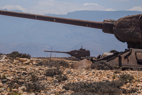 Rusty T-34 tank wreck abandoned in desert landscape, Socotra