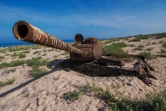 Rusty T-34 tank wreck abandoned on coastal dune, Socotra