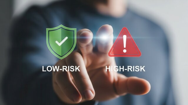A conceptual and modern digital interface, featuring a human hand pointing at two prominent virtual graphic icons: a vibrant green shield with a checkmark signifying 'LOW-RISK' and a bold red warning