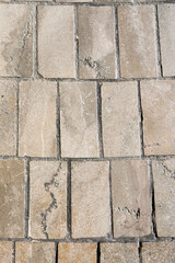 Fototapeta premium A medieval street paved with stone tiles.