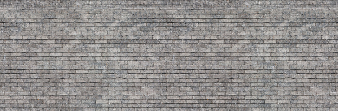 Concrete gray block wall seamless background texture &ndash; old grey brick pattern building.