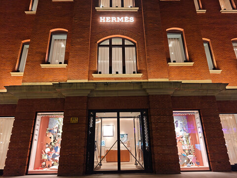 Shanghai,China-Oct.16th 2025: front facade of Herm&egrave;s flagship store in a red brick building