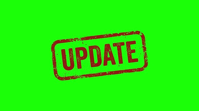 Red update stamp on bright green background for editing purposes