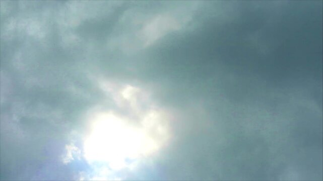 Huge heap gray cloud slow moving pass the sun