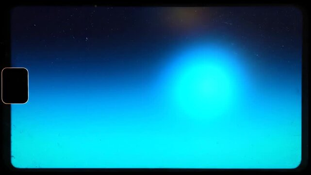 Film Texture Background with Abstract Blue Gradient Vintage Grain Scratches Light Leaks and a Film Perforator Mark