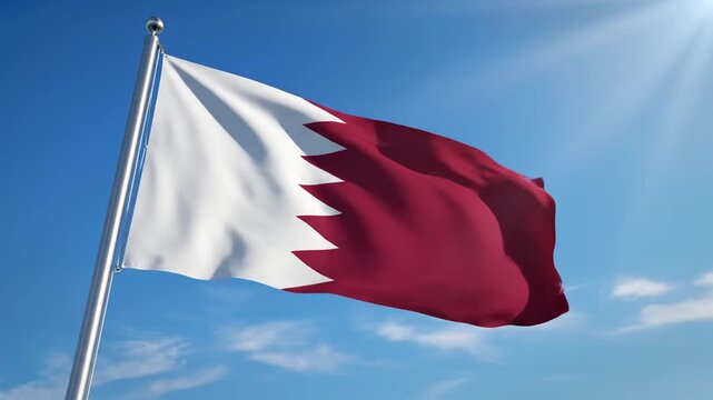 Majestic Qatar National Flag with Serrated White and Maroon Pattern Waving Gracefully Against a Clear Blue Sky Background Symbolizing Patriotism and Qatari Sovereignty in High Definition.
