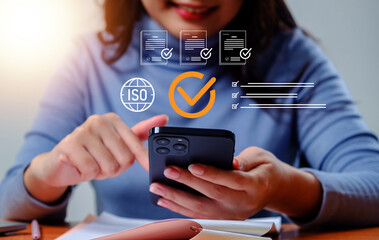 Woman digital checklist and ISO compliance icons, representing quality assurance, audit process, certification standards, workflow validation, and modern mobile technology in business management