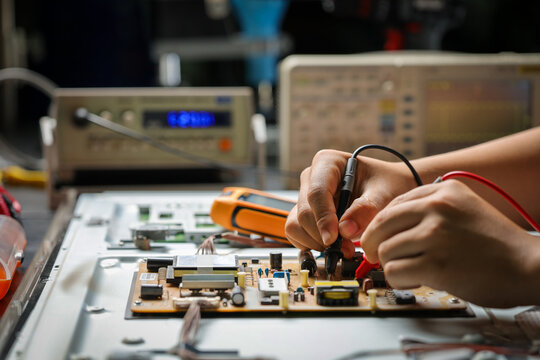 Electronics technician, electronic engineering electronic repair,electronics measuring and testing, repair and maintenance concepts.