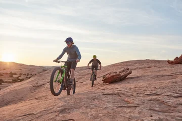 Fototapeten Extremsportarten Men, mountain bike or cycling with sunset on dirt hill in dunes for extreme sport together. Active, male people or cyclist riding with bicycle for outdoor challenge or adrenaline rush in wilderness  © peopleimages.com