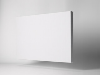 Fototapeta premium A blank white canvas leaning against a wall in a modern studio with soft lighting