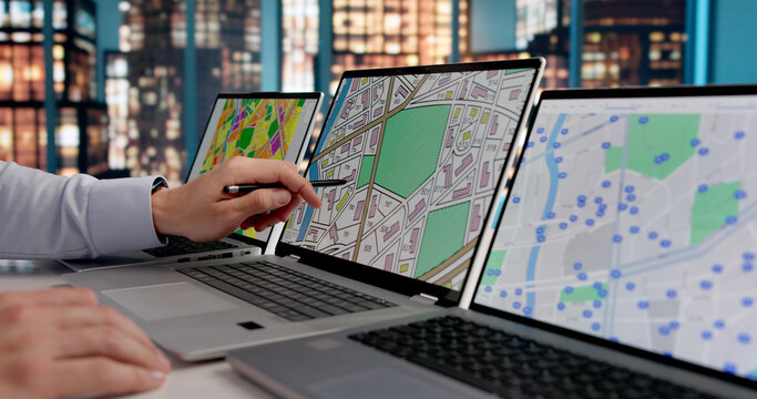 Young Hispanic GIS Specialist Analyzes Urban Cadastre Map