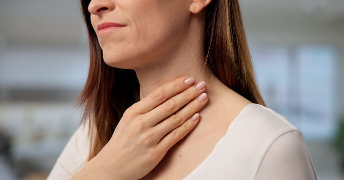 Woman Experiencing Neck Pain From Throat And Salivary Gland Issues