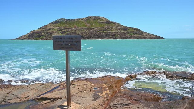 slow motion of you are standing at the northernmost point of the australian continent sign at the tip of Cape York along the coastline of the torres strait in tropical north Queensland, Australia.